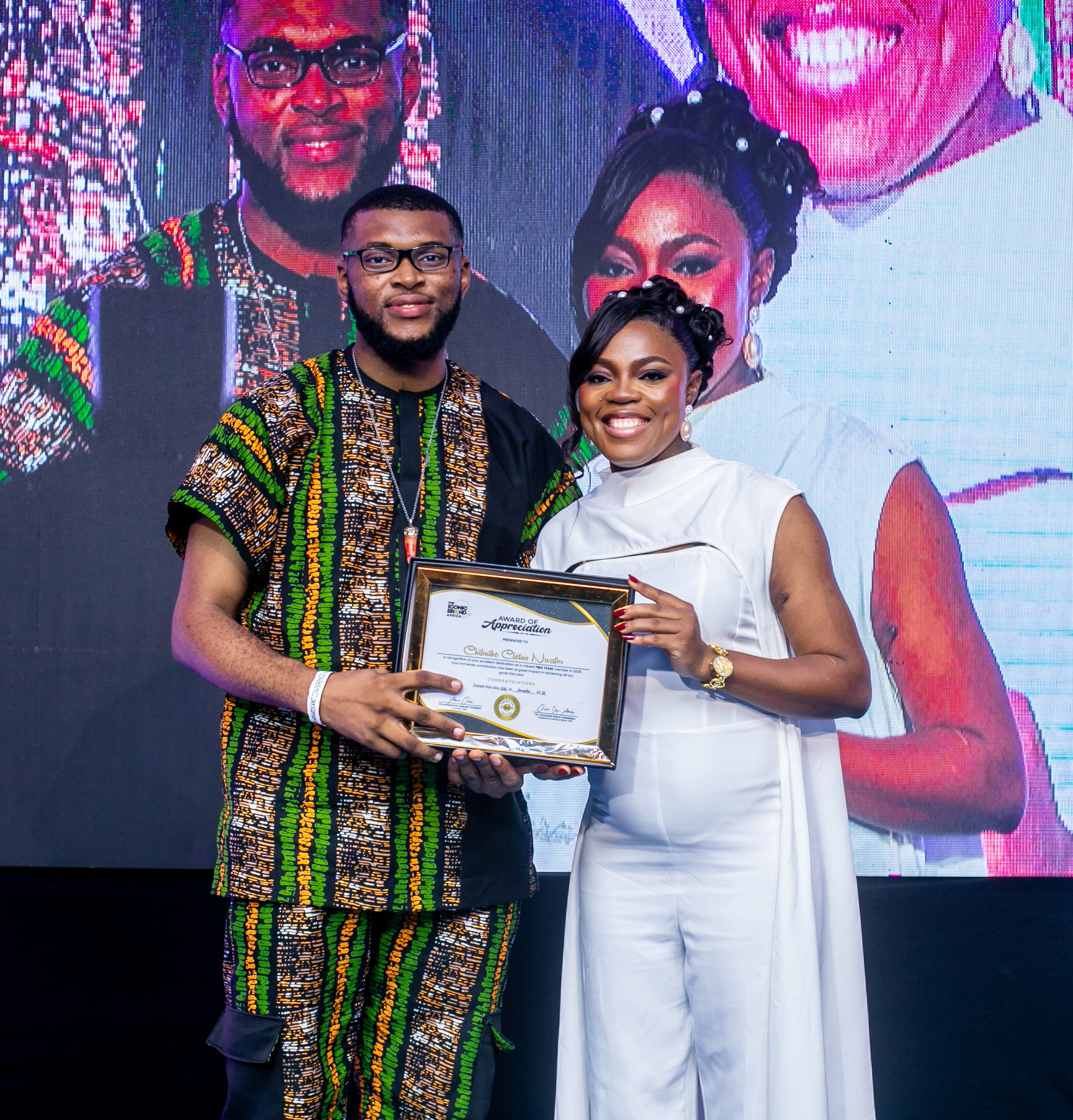 Chibuike Cletus Nwafor receiving an Award of Appreciation at The Iconic Brand Africa event
